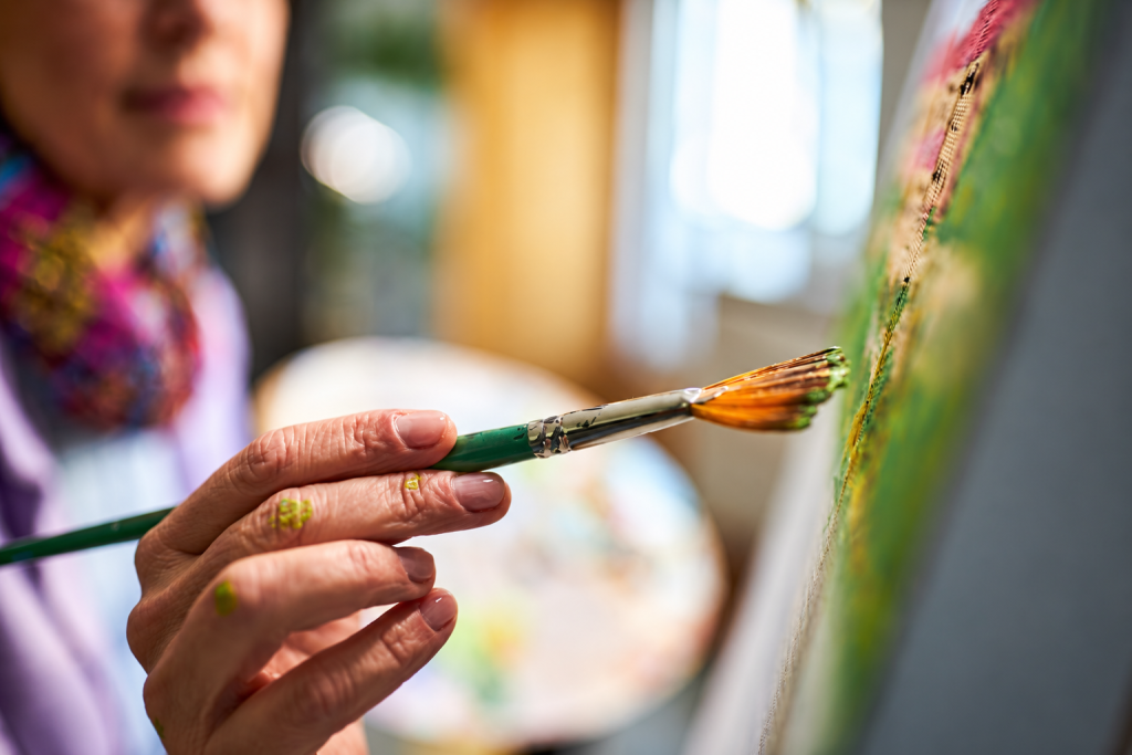 Sabri Zidan helping homeowners compare warm natural paint colors in a Bay Area living room